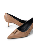 Tan leather pointed-toe kitten heel pump, featuring bow-tie accent