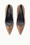 Pair of tan pointed-toe kitten heel pumps; ST logo on black insole