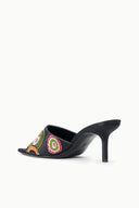 Black heeled slide mule with colorful beadwork on front, open toe, side view