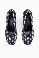 Two peep-toe wedge heels with dark floral print uppers, top view