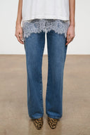 Cheetah-print ankle boots with low heel, worn with blue jeans