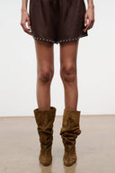 Brown ruched slouch boots with stacked heel, mid-calf shaft