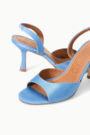 Light blue satin slingback heeled sandals, close angle showing straps