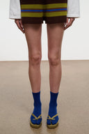Thong underwear with dark brown waistband and blue-and-yellow stripe trim