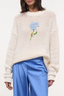 Cream knit sweater with embroidered blue flower and green stem, crewneck long sleeves