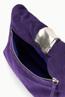 Purple cuff clutch with open interior, silver clasp, and zipper top