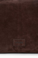 Brown suede handbag close-up of rear logo patch