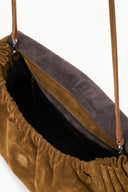Cigar brown convertible bag open top showing drawstring and dark lining