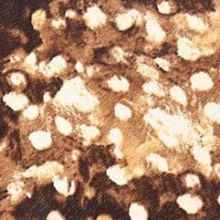 Fawn haircalf clutch with mottled tan and cream fur texture
