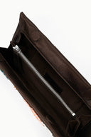 MUSE clutch interior view with black lining and silver zipper track