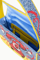 TOMMY beaded bag open detail, yellow zip top and blue interior with phone print.