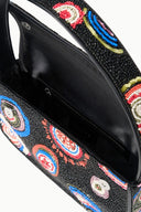 Black beaded handbag open interior with zipper pocket and colorful embroidered front trim