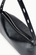 Black shoulder bag detail with front zipper and perforated strap