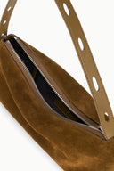 Brown suede shoulder bag interior with zippered compartment and perforated strap