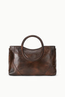 Espresso brown distressed leather satchel, oval handle and side profile with seams