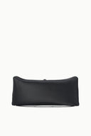 Black clutch bag with smooth fold-over shape and flat base