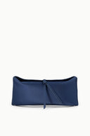 Dark sapphire blue clutch with gathered top and central tie strap