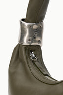 Winter moss bag with metallic cuff strap and hidden zipper pocket detail