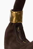 Espresso suede bag with wide gold cuff strap and zip pocket detail