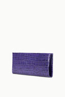 Purple croc-embossed leather clutch with slim profile and fold-over front