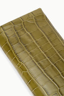Olive crocodile-texture clutch bag close-up of embossed pattern