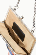 Beaded frame bag close-up: chain strap, clasp hardware, black inner pocket