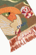 Beaded frame bag detail: multicolor beaded artwork with orange fringe tassels