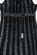 Dark knit bag with vertical beaded stripes and small front logo patch