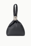 Black leather cuff bag with silver top handle and gathered pouch silhouette
