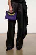 Carys croc-embossed clutch with purple body and curved yellow interior panel