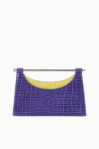 Crocodile-pattern purple clutch with silver bar handle and yellow-lined interior