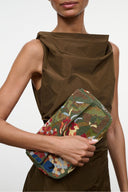 Timmy convertible shoulder bag with dark green body and multicolor patterned panel on strap