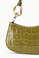 Olive croc-embossed bag front panel with metal clasp and STAUD stamp