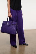 Purple croc carryall tote with short handles and structured front flap