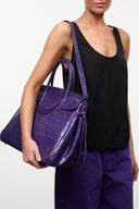 Purple croc-embossed carryall tote with double handles and front flap