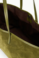 Martini green tote bag interior with brown lining and inner open pocket with logo tab
