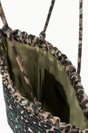 Leopard-print tote bag with green satin lining and side drawstring