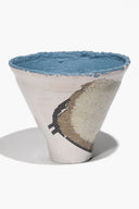 Wide ceramic sheep vase, blue rim, white body with speckled leg and face marks