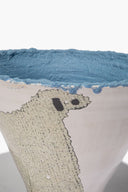Wide ceramic sheep vase, blue textured rim and sheep face patch detail on white