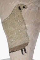 Ceramic sheep vase cone close-up showing speckled beige sheep motif on front