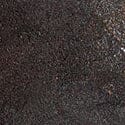Natural stone rock bookend close-up, dark brown speckled surface texture