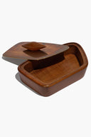 Vintage brown wooden trinket box with open lid, carved handle, empty interior