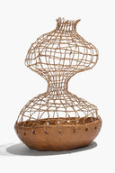 Organic twine mesh ceramic sculpture with hourglass form, tan base and stitched eyelets