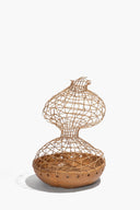 Small twine mesh ceramic sculpture with rounded base and tan grommet band