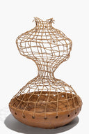 Twine mesh ceramic sculpture with rounded base, hourglass neck, and perforated tan strap band