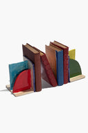 Ceramic bookends set with blue, brown, red, and yellow glossy glazed panels.