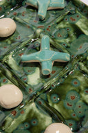 Ceramic tic tac toe game board with green earth-glaze tiles and star plus round pieces