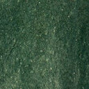 Forest-green glazed ceramic surface texture with speckled finish