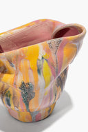 Ceramic vase close-up with pink interior, yellow-orange and multicolor abstract drip glaze