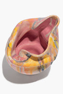 Ceramic vase with teardrop shape, pink interior and orange, blue, and purple streaked glaze